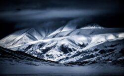 High in the Altai Mountains of Mongolia, the landscape stretches into a seemingly endless world of snow, ice, and rugged peaks. Here, winter transforms the mountains into a place of extraordinary beauty—remote, silent, and almost untouched by time.There is a profound sense of solitude in this landscape. The scale of the mountains makes everything else seem insignificant, while the simplicity of snow and sky reveals the raw architecture of the land beneath.Kingdom of Ice and Snow captures the majesty of one of the world’s great wildernesses—a place where beauty is found not in abundance, but in space, silence, and isolation.At the edge of the world, winter reigns—and silence becomes the landscape. Kingdom of Ice and Snow