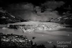 Rising from the frozen landscape of Patagonia, the Perito Moreno Glacier stands as a monument to the immense power and beauty of the natural world. Its towering walls of ancient ice, sculpted by time and movement, create a landscape that feels both permanent and constantly changing.Before something of this scale, perspective shifts. The noise of the world seems to disappear, replaced by ice, distance, and an overwhelming sense of time.The Silent Giant captures more than a glacier—it captures the feeling of standing before something far greater than ourselves, shaped over centuries and still slowly moving through the landscape.Ancient, immense, and ever changing, the ice reminds us how small we are—and how extraordinary our world remains. The Silent Giant